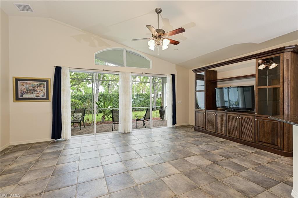 9290 Springview Loop Estero, FL 33928 - Photo 3 of 25 a view of an empty room with window and chandelier fan
