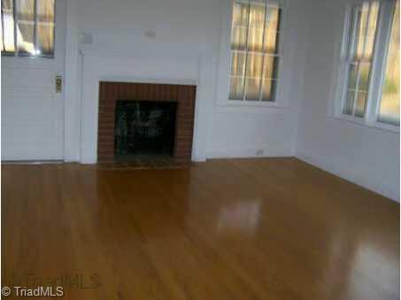 1004 Quaker Road Mount Airy, NC 27030 - Photo 2 of 9 Other. Beautiful hardwood floors in living room with fireplace