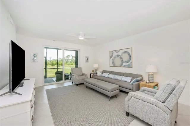 a view of living room with furniture and flat screen tv