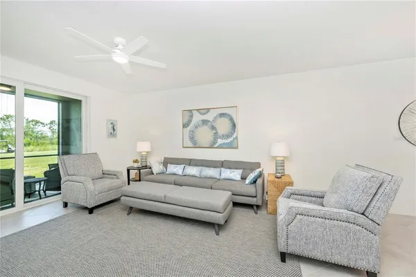 a bedroom with furniture and flat screen tv