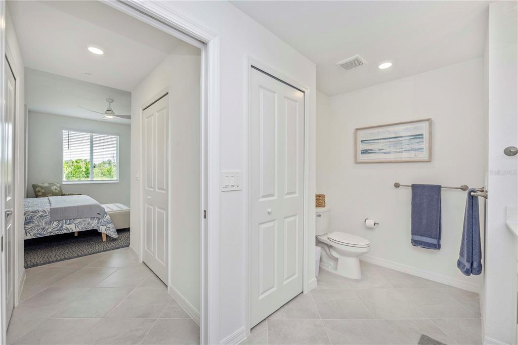 17500 Opal Sand Drive, Unit 101 Venice, FL 34293 - Photo 30 of 98 a en suite bathroom with a toilet a sink and a window
