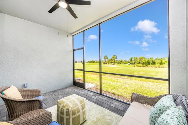 a view of a room with gym equipment and a large window