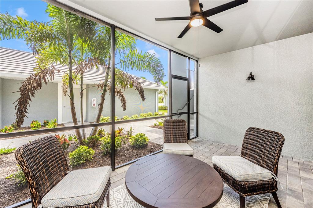 17500 Opal Sand Drive, Unit 101 Venice, FL 34293 - Photo 43 of 98 a living room with furniture and a potted plant