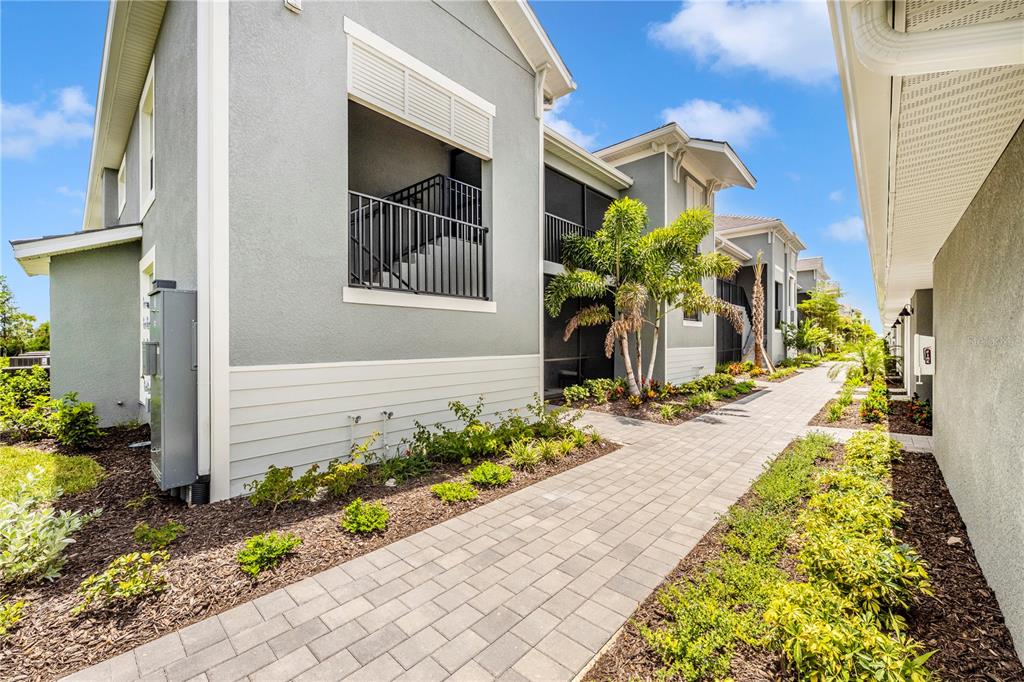 17500 Opal Sand Drive, Unit 101 Venice, FL 34293 - Photo 51 of 98 a front view of a house with a yard