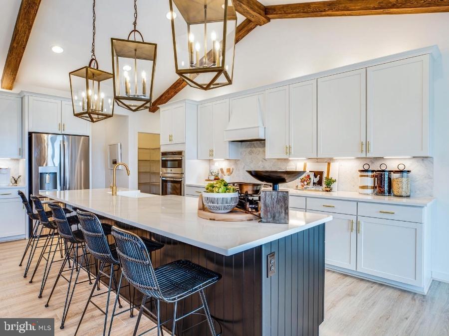 1 Spotswood Furnace Road Fredericksburg, VA 22407 - Photo 10 of 24 a kitchen with stainless steel appliances a table chairs and a wooden floors