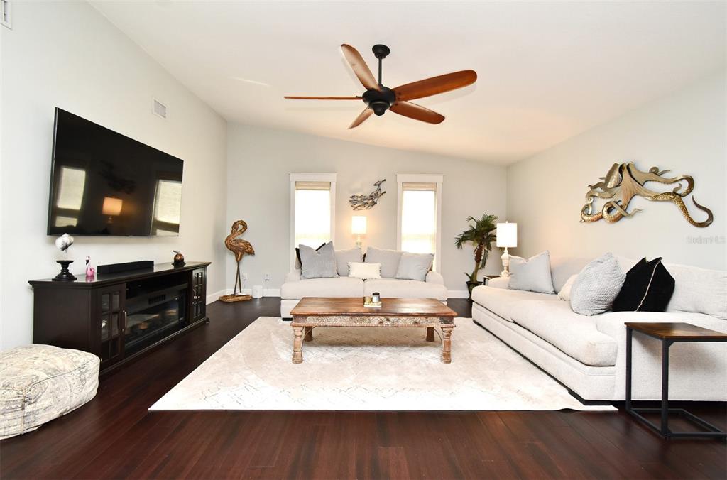 1312 2nd Street Edgewater, FL 32132 - Photo 11 of 41 a living room with furniture and a flat screen tv