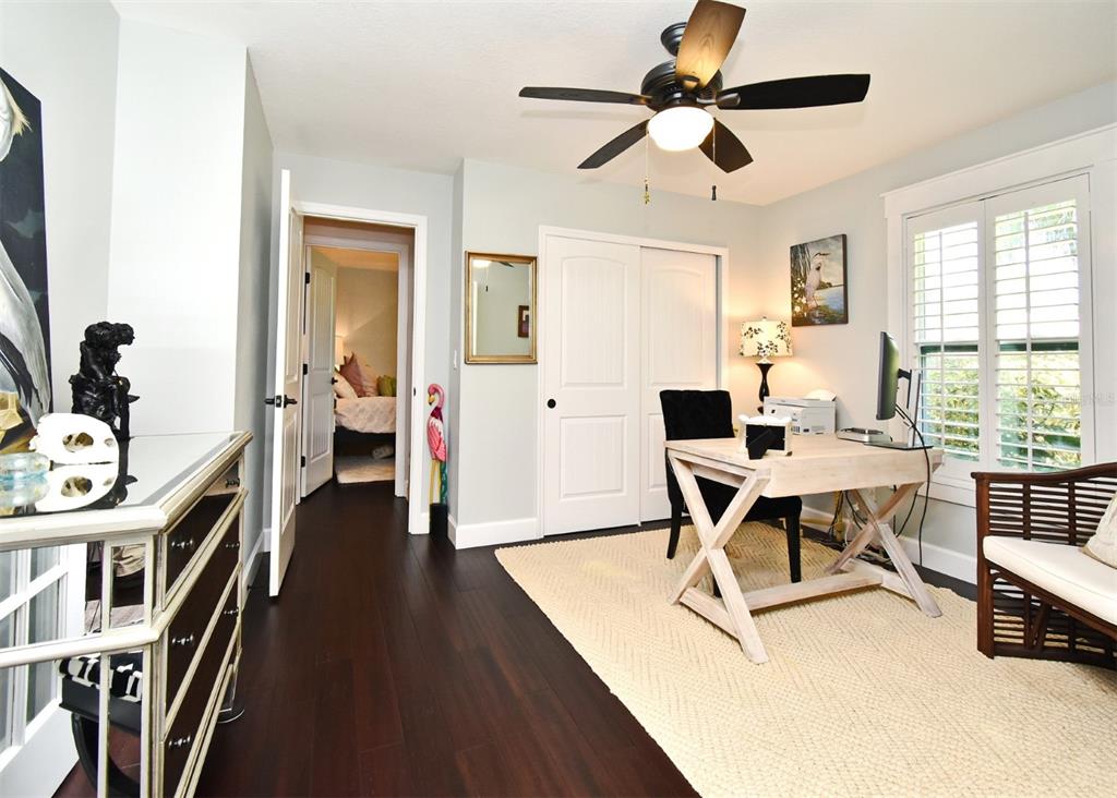 1312 2nd Street Edgewater, FL 32132 - Photo 18 of 41 a workspace with furniture hardwood and a window