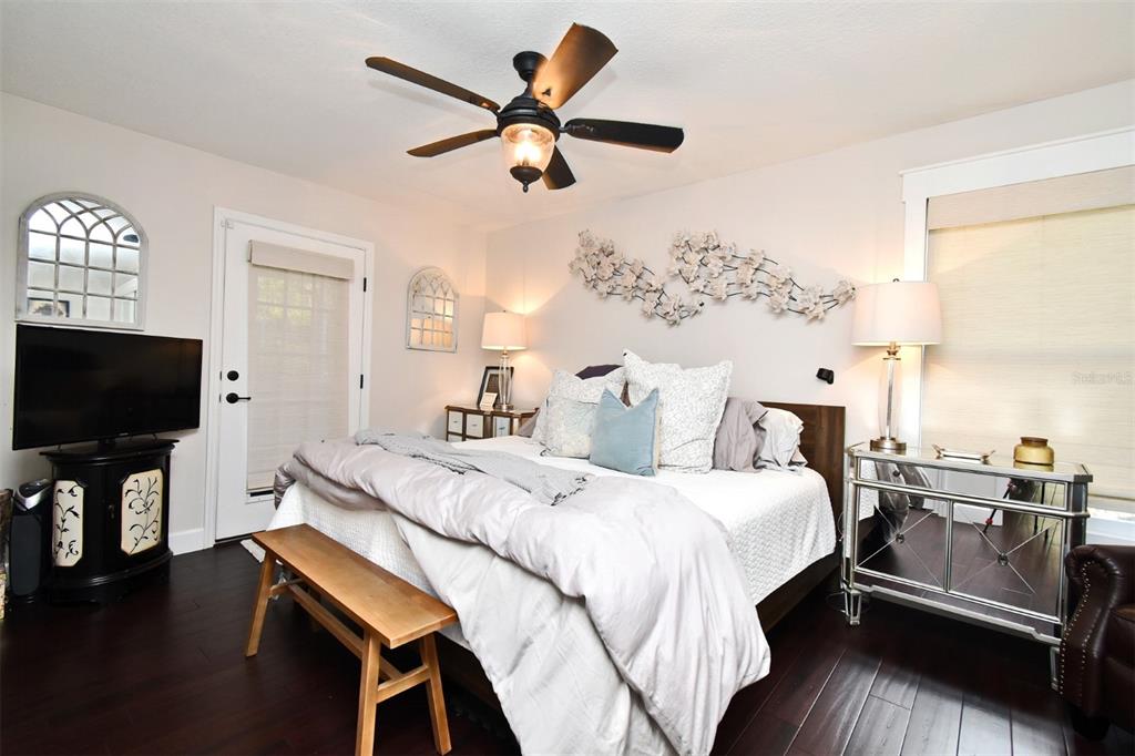 1312 2nd Street Edgewater, FL 32132 - Photo 22 of 41 a bedroom with a bed and a flat screen tv