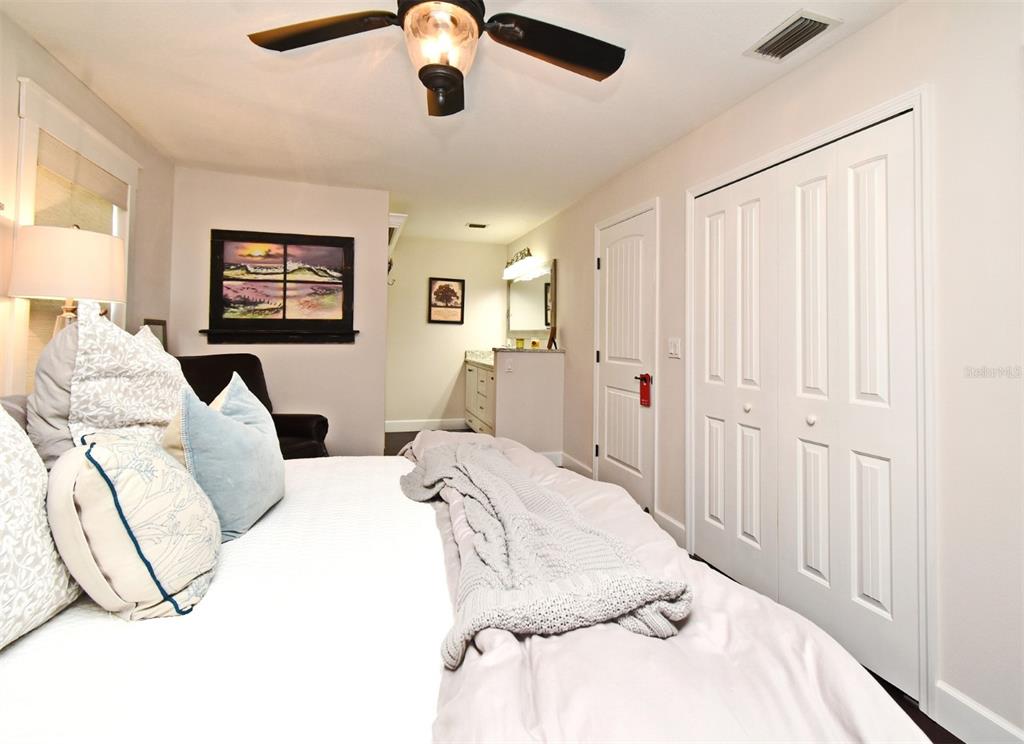 1312 2nd Street Edgewater, FL 32132 - Photo 23 of 41 a bedroom with a bed and a painting on the wall