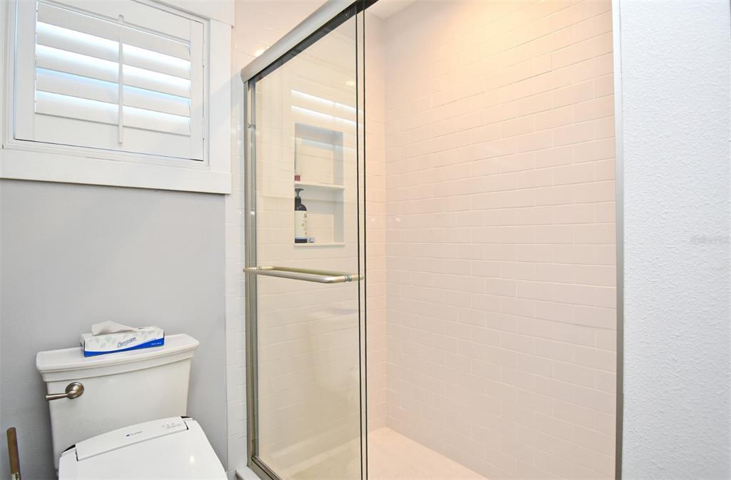 1312 2nd Street Edgewater, FL 32132 - Photo 25 of 41 a bathroom with a toilet and a shower