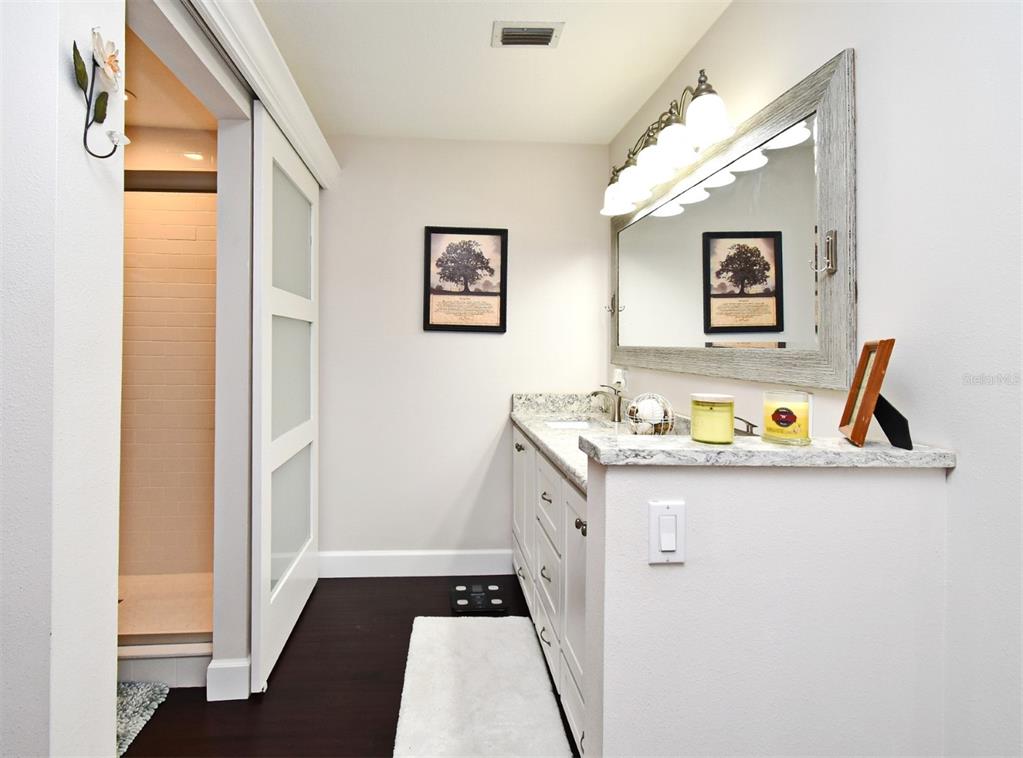 1312 2nd Street Edgewater, FL 32132 - Photo 27 of 41 a view of bathroom with mirror and window