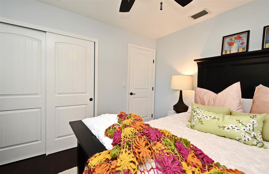 1312 2nd Street Edgewater, FL 32132 - Photo 29 of 41 a bedroom with a bed and wooden floor