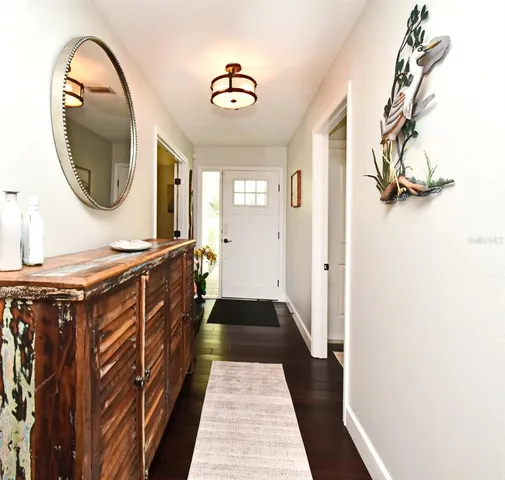 a dining room with furniture and wooden floor