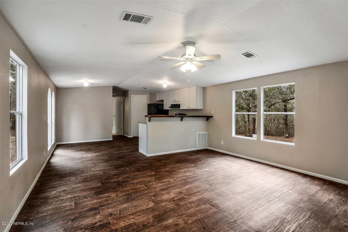 2610 Myrtle Loop Middleburg, FL 32068 - Photo 6 of 17 07-Living Room to Kitchen