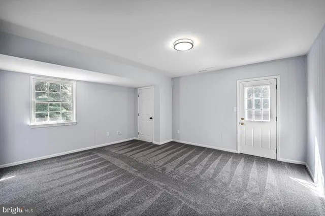 a view of a room that has a window in it