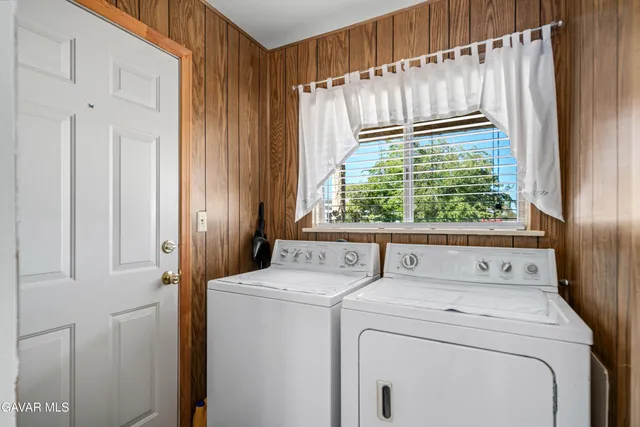 a view of a hallway with closet and a livingroom view