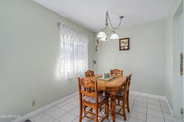 a kitchen with granite countertop a stove a refrigerator and a stove