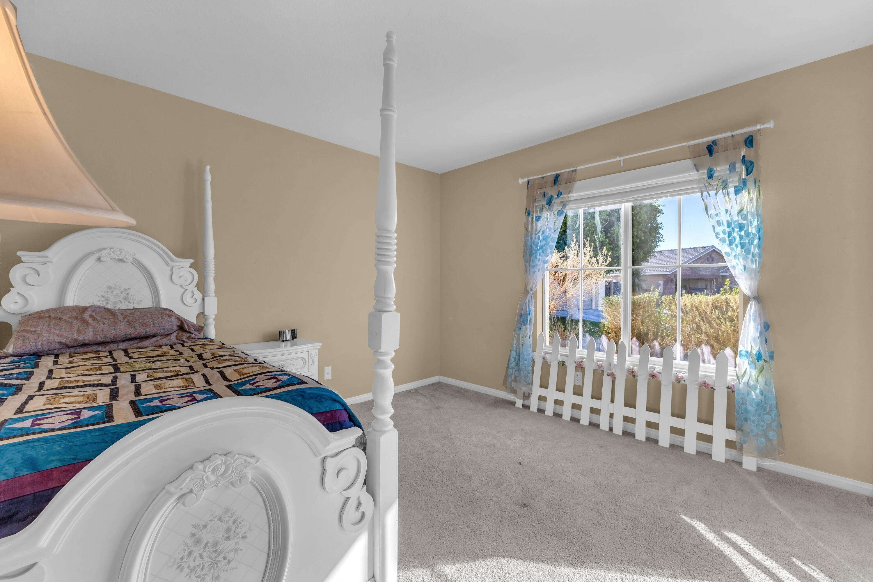 83480 Firecliff Court Indio, CA 92203 - Photo 11 of 61 a bedroom with a bed and a window