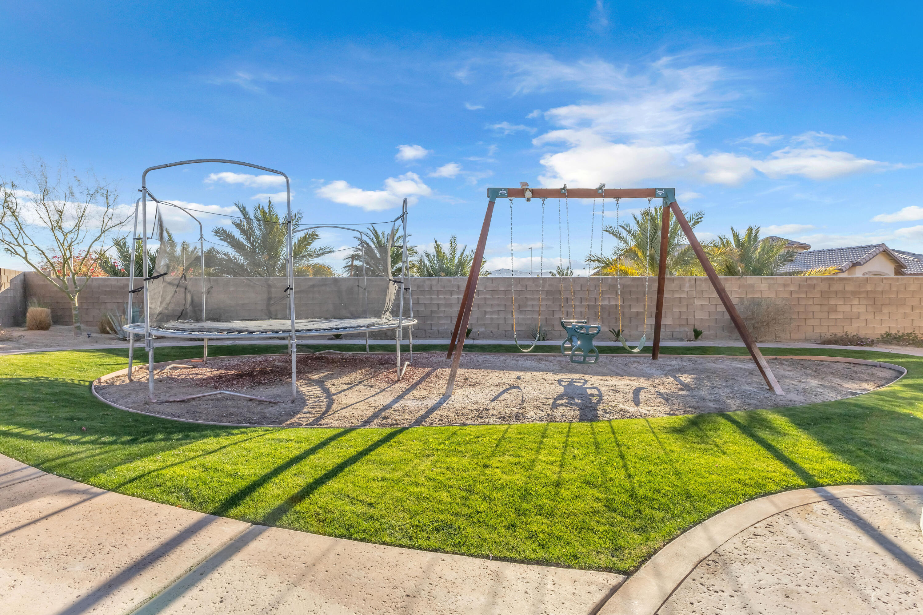 83480 Firecliff Court Indio, CA 92203 - Photo 15 of 61 a view of a swimming pool with a yard
