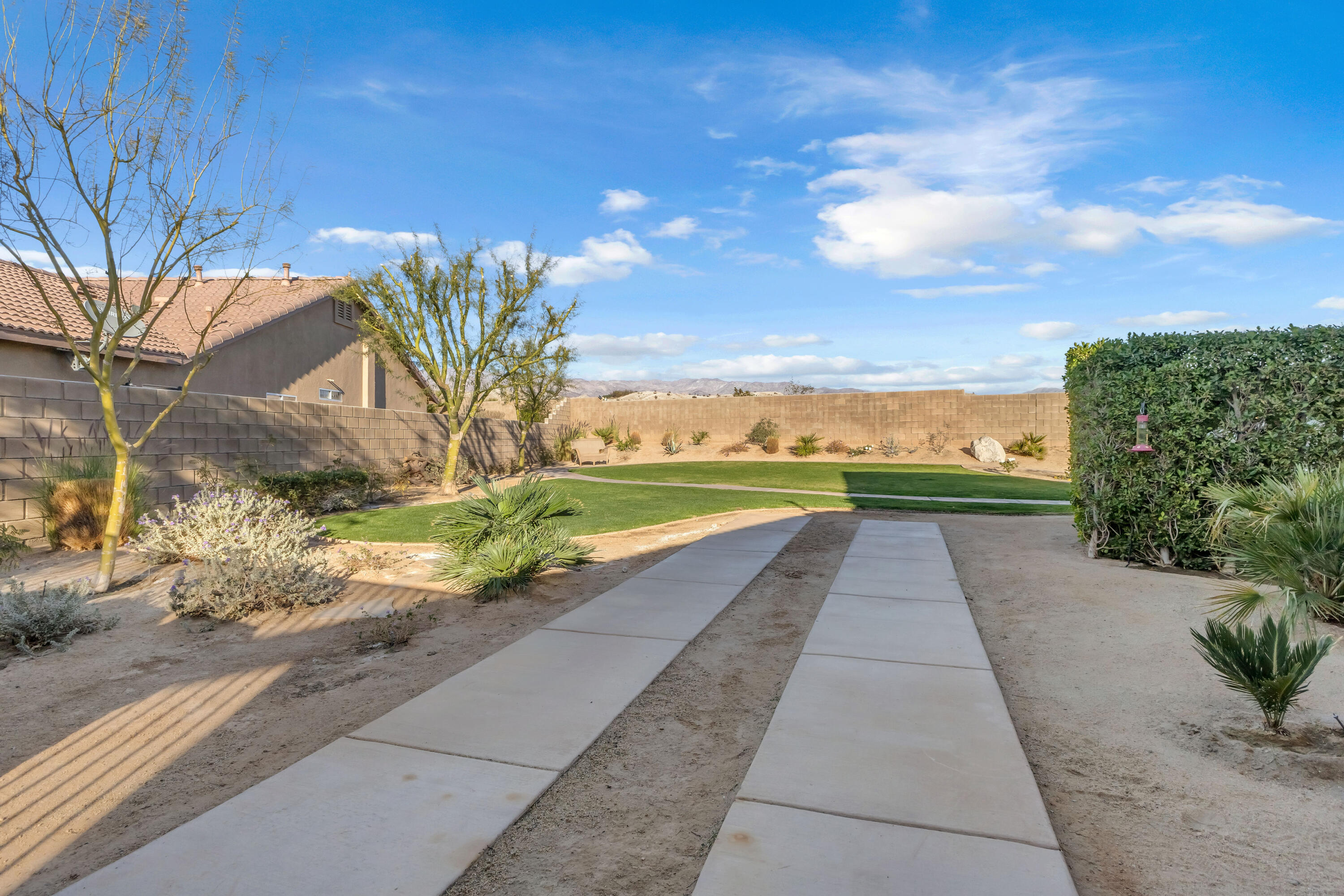 83480 Firecliff Court Indio, CA 92203 - Photo 17 of 61 a view of a pathway with a yard