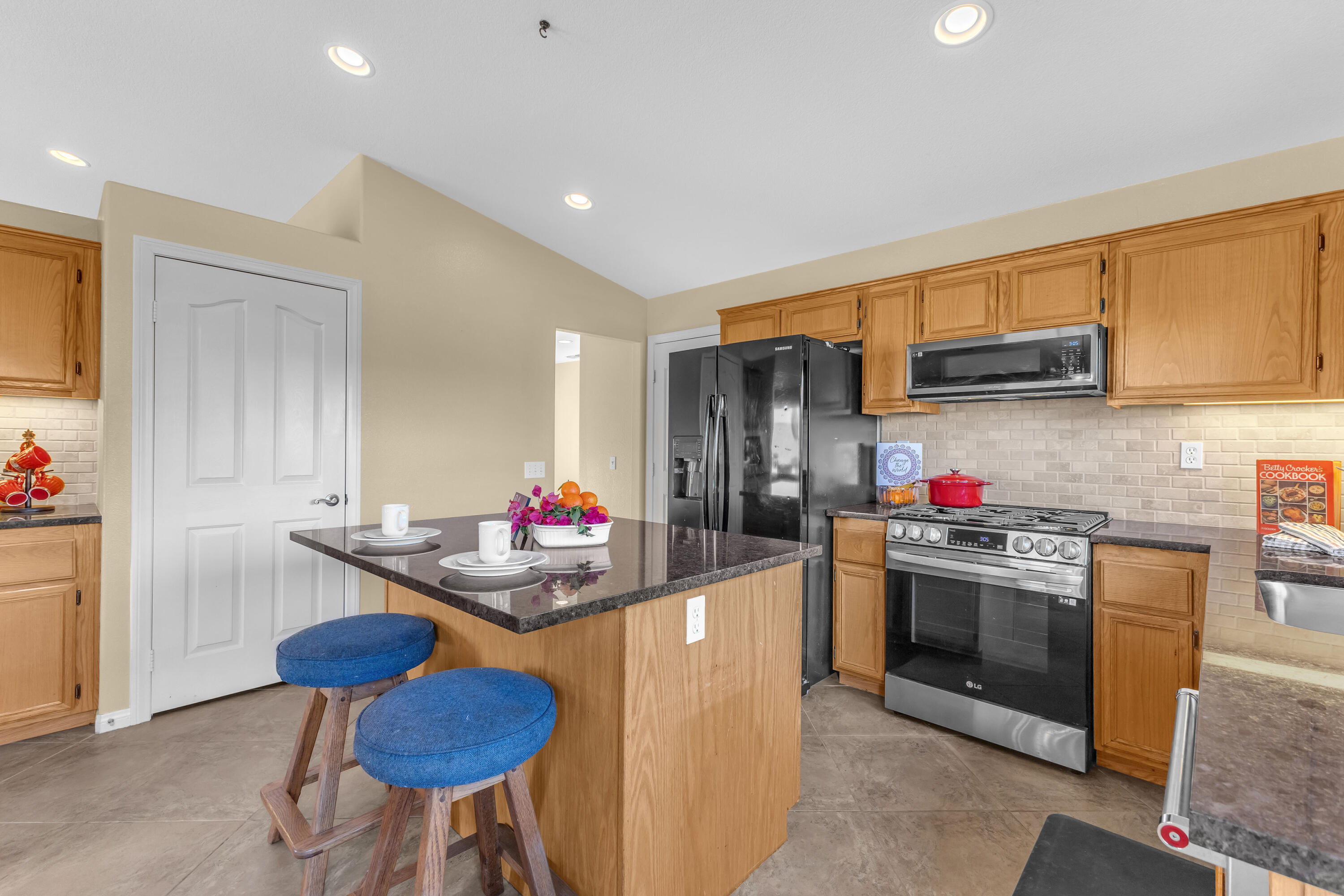 83480 Firecliff Court Indio, CA 92203 - Photo 29 of 61 a kitchen that has a sink and a stove in it