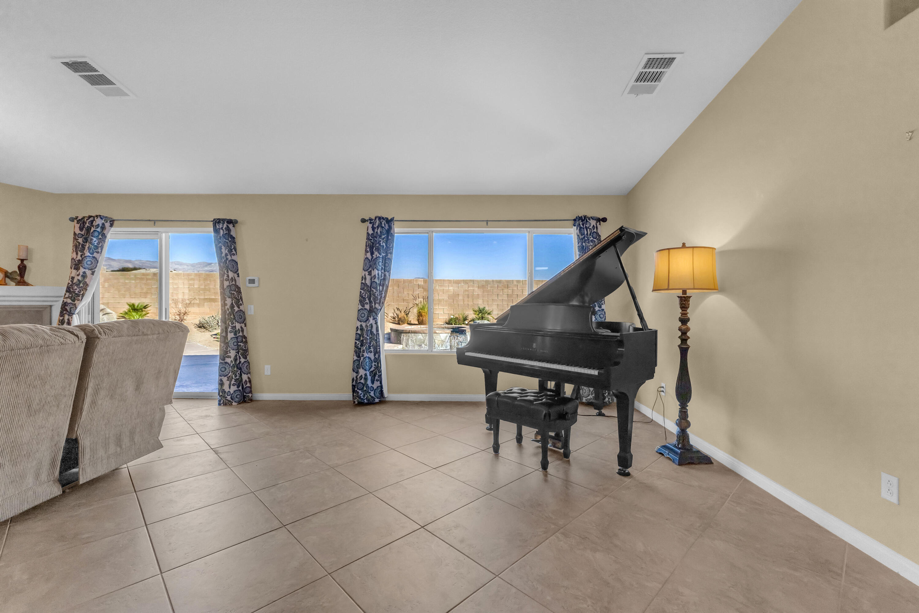 83480 Firecliff Court Indio, CA 92203 - Photo 7 of 61 a living room with furniture and a table