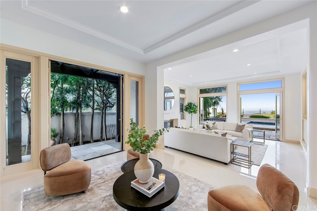 11 Vista Luci Newport Coast, CA 92657 - Photo 19 of 63 a living room with furniture and a large window
