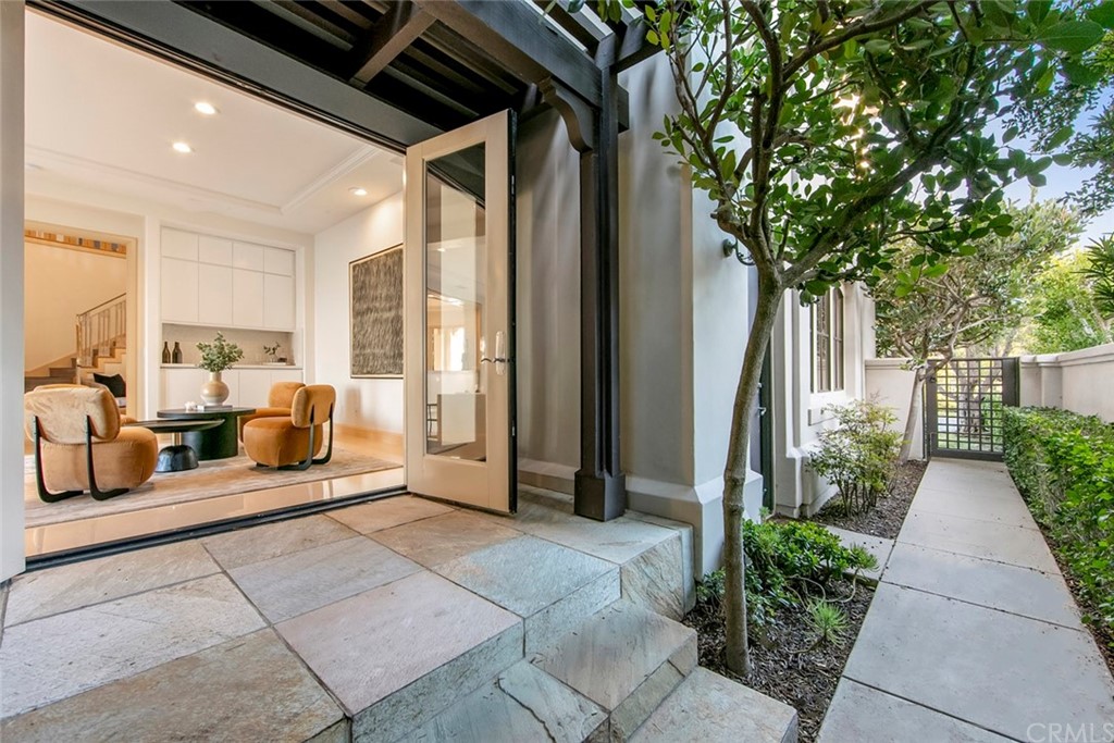 11 Vista Luci Newport Coast, CA 92657 - Photo 22 of 63 a view of a couches in the patio with a couple of flower plants