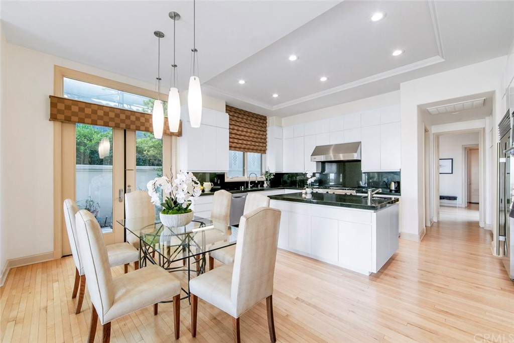 11 Vista Luci Newport Coast, CA 92657 - Photo 25 of 63 a view of a dining room with furniture a chandelier and wooden floor