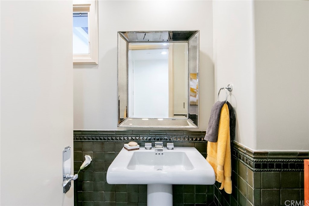 11 Vista Luci Newport Coast, CA 92657 - Photo 47 of 63 a bathroom with a sink and a mirror