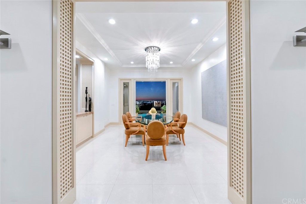 11 Vista Luci Newport Coast, CA 92657 - Photo 50 of 63 a dining room with furniture and a chandelier