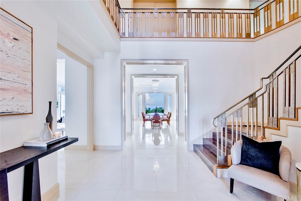 11 Vista Luci Newport Coast, CA 92657 - Photo 6 of 63 a kitchen with stainless steel appliances granite countertop a sink and a refrigerator