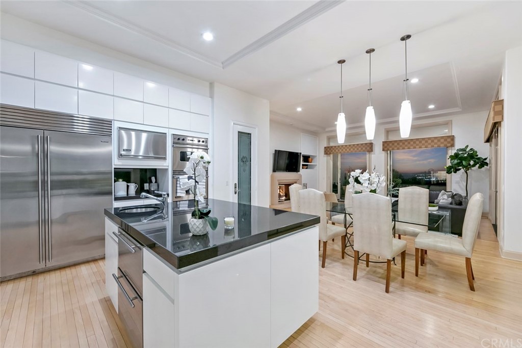 11 Vista Luci Newport Coast, CA 92657 - Photo 52 of 63 a kitchen with stainless steel appliances granite countertop a sink and a refrigerator