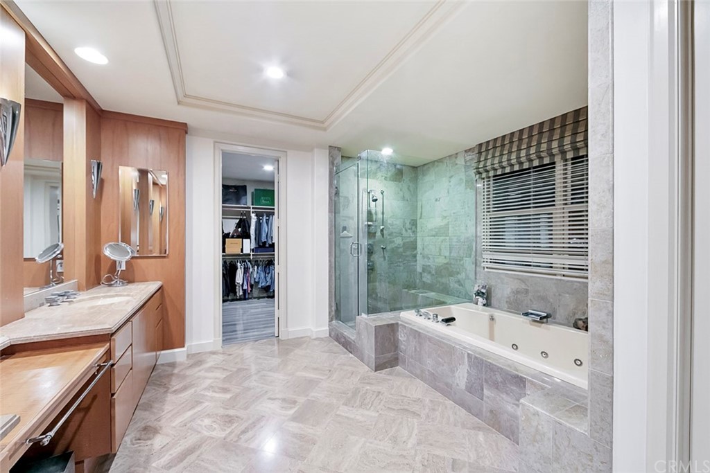 11 Vista Luci Newport Coast, CA 92657 - Photo 56 of 63 a bathroom with a tub sink shower and mirror