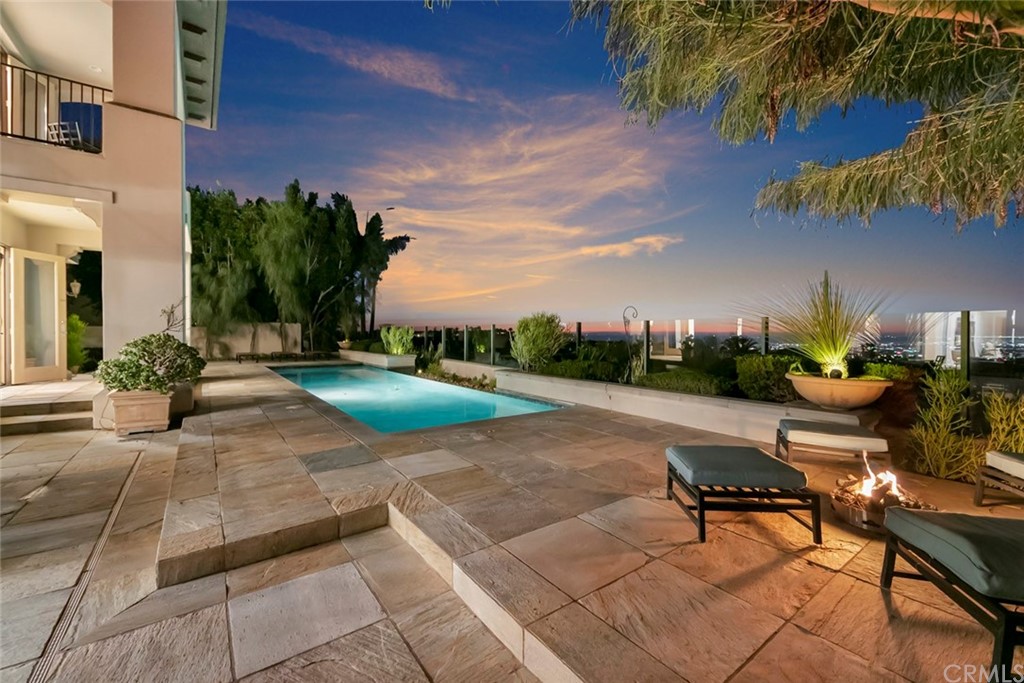 11 Vista Luci Newport Coast, CA 92657 - Photo 61 of 63 a backyard of a house with table and chairs