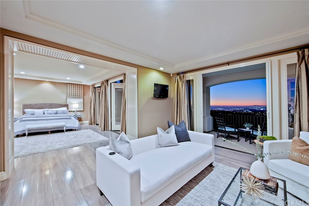 11 Vista Luci Newport Coast, CA 92657 - Photo 10 of 63 a living room with furniture and a flat screen tv