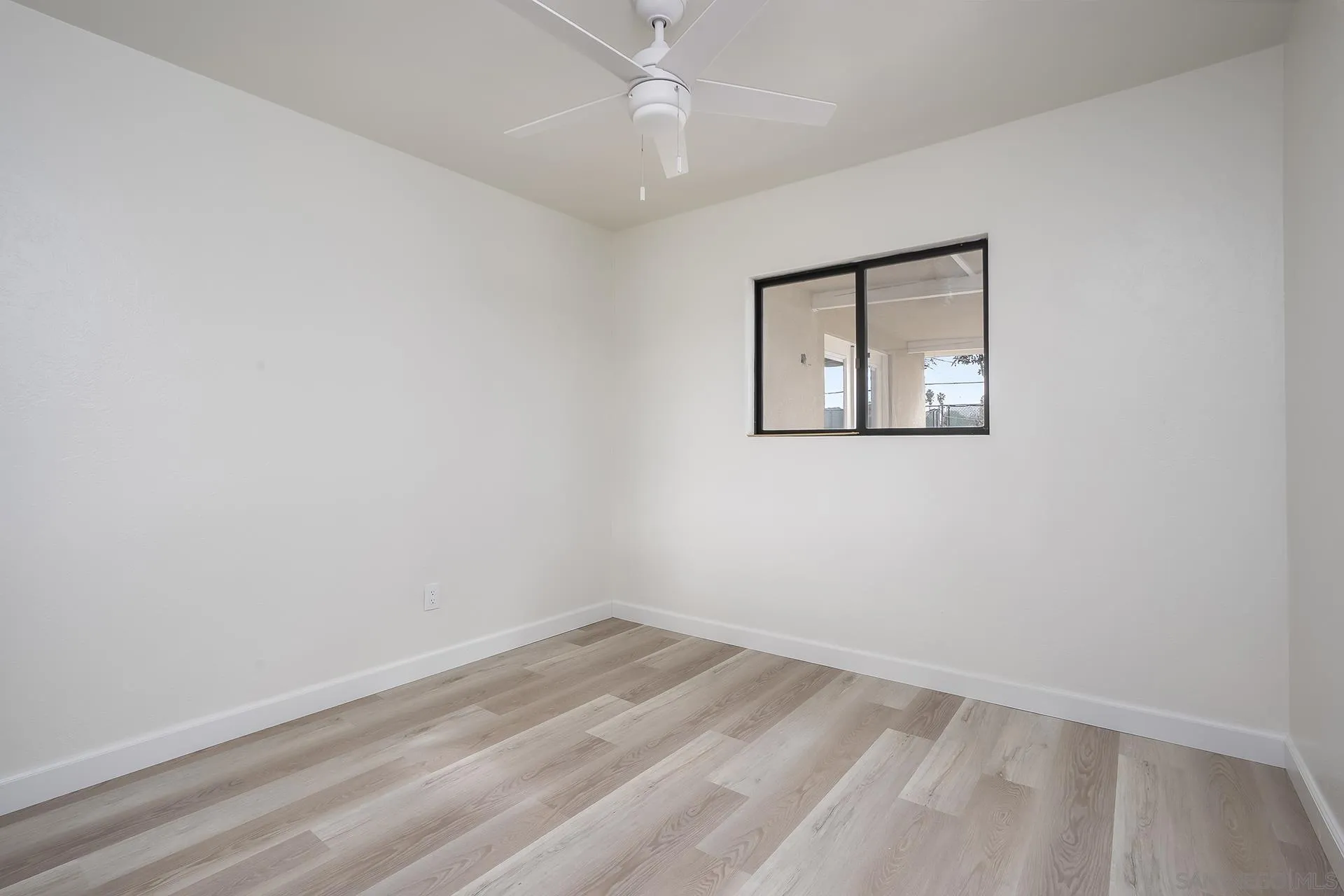 9213 Fenway Road Santee, CA 92071 - Photo 18 of 25 an empty room with a window and ceiling fan