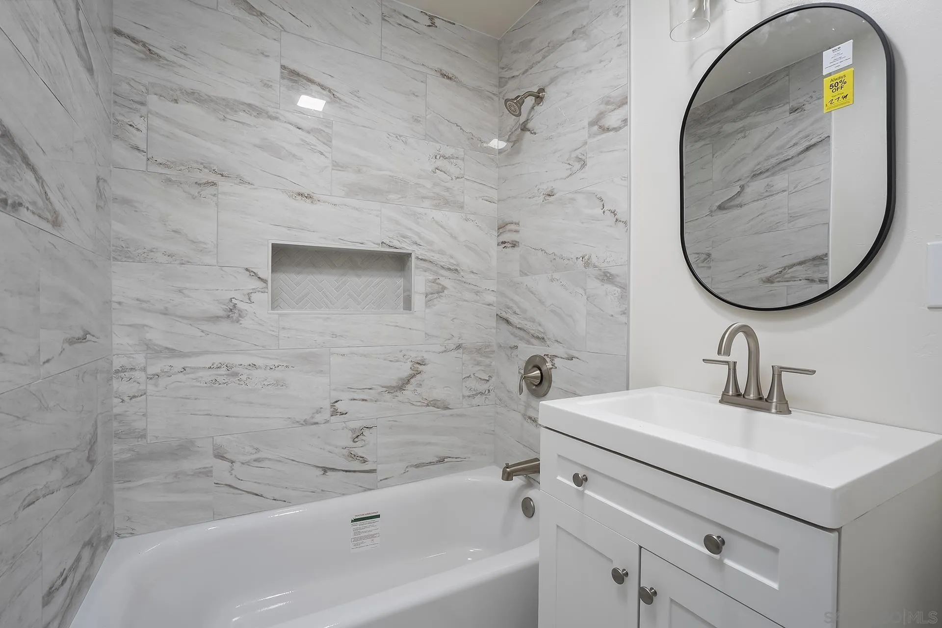 9213 Fenway Road Santee, CA 92071 - Photo 19 of 25 a bathroom with a sink a bathtub and a mirror