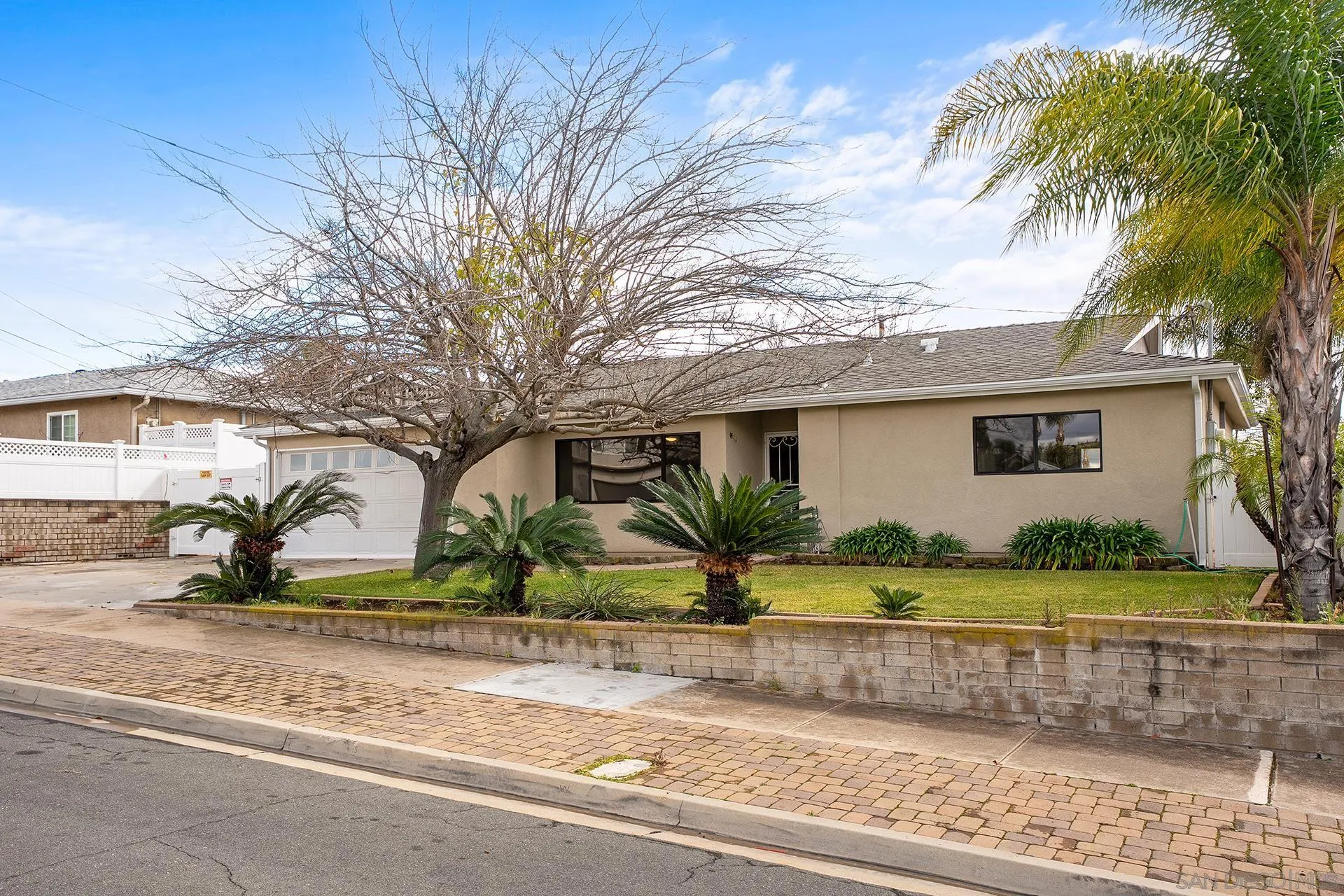 9213 Fenway Road Santee, CA 92071 - Photo 2 of 25 front view of house with a yard