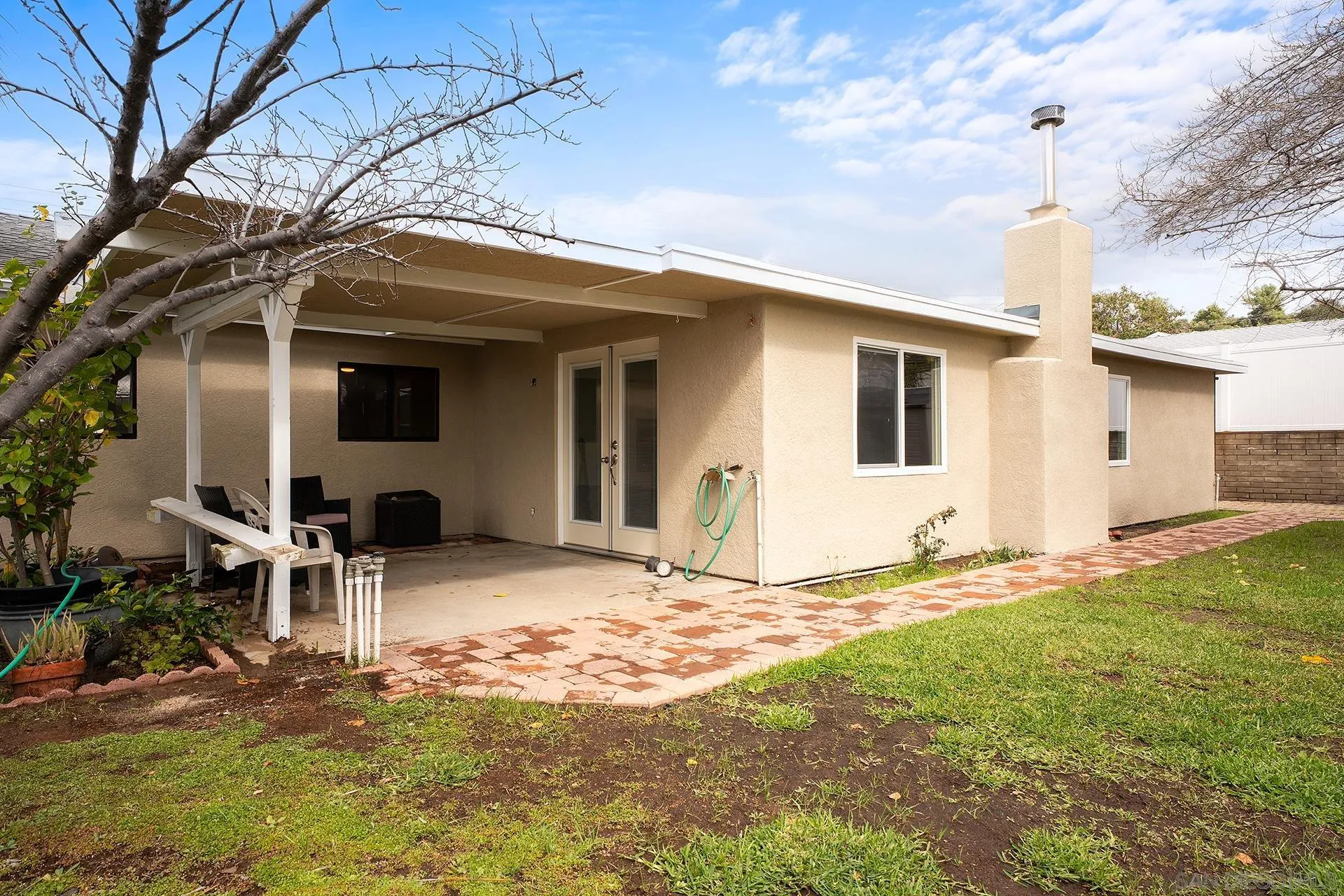9213 Fenway Road Santee, CA 92071 - Photo 23 of 25 a backyard of a house with table and chairs