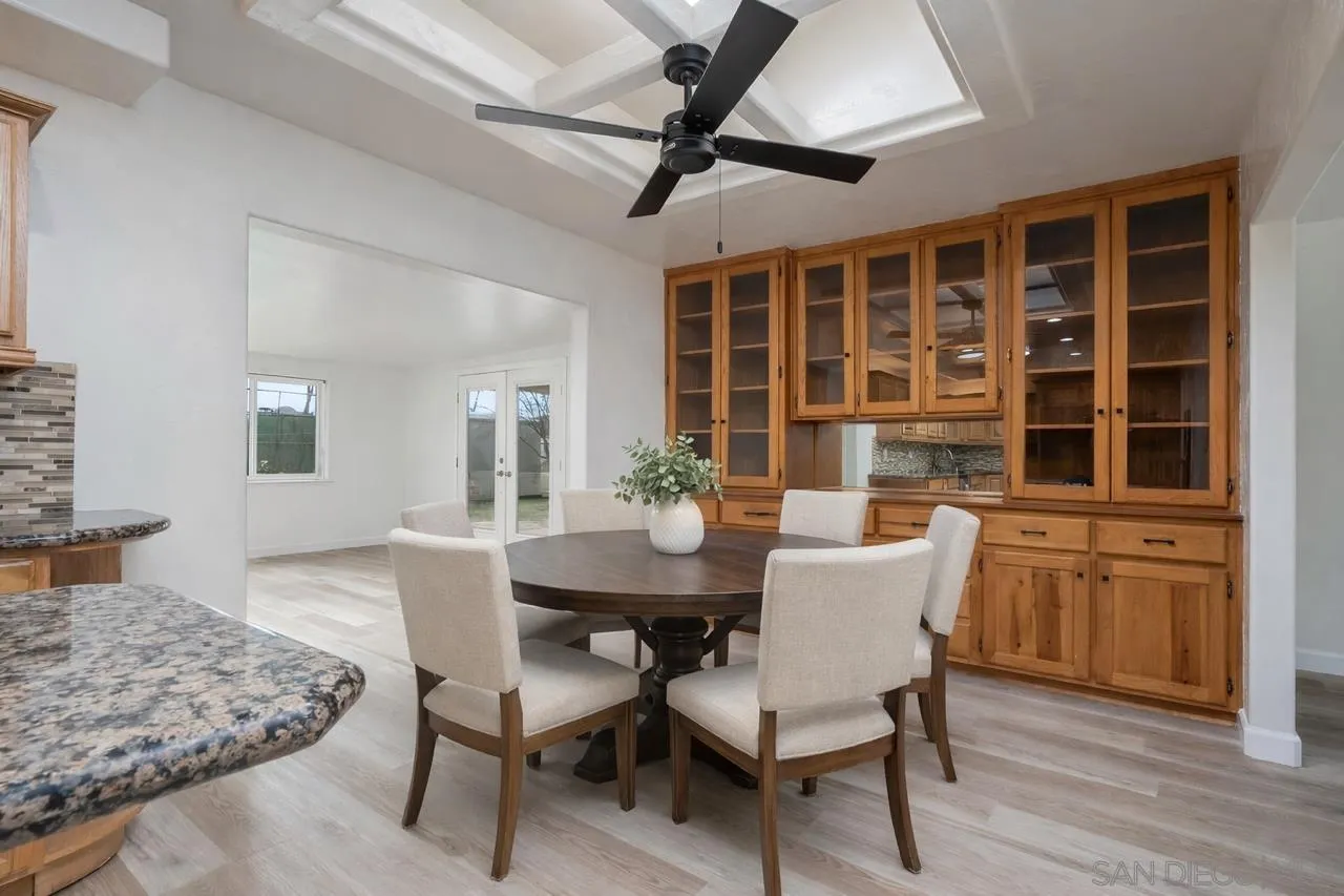 9213 Fenway Road Santee, CA 92071 - Photo 4 of 25 a view of a dining room with furniture window and wooden floor