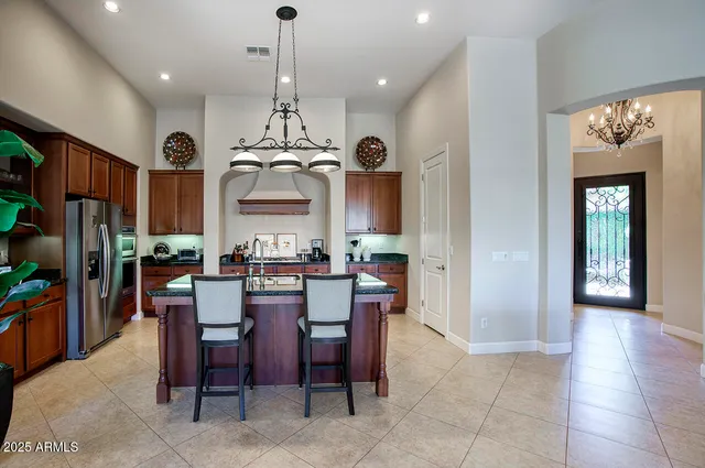 a view of a dining room with furniture and chandelier