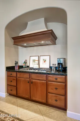 a kitchen with granite countertop cabinets and stainless steel appliances