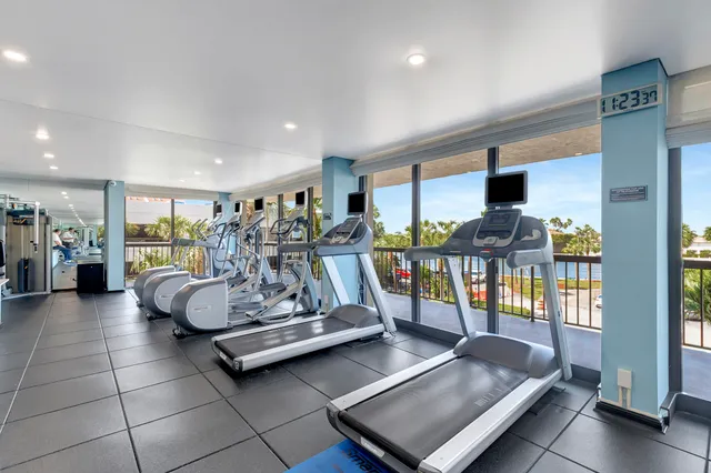 a room with lots of chairs and mirrors