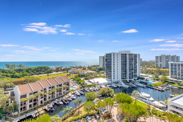 an aerial view of a house with a swimming pool and outdoor seating