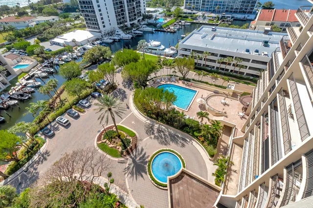 a view of a patio with chairs and plants