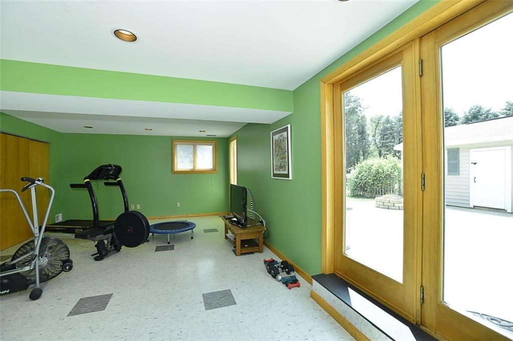 462 Scott Ridge Road Harmony, PA 16037 - Photo 22 of 25 GAME ROOM walks out to the FENCED IN large concrete patio, storage garage, or 1 Acre property.