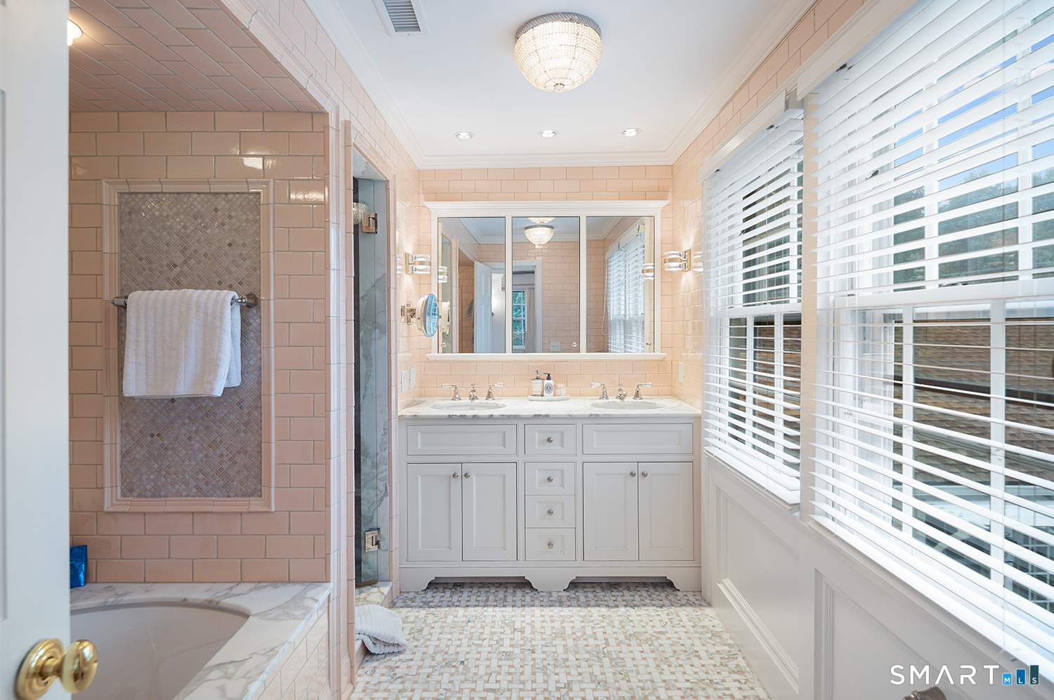 775 Sasco Hill Road Fairfield, CT 06824 - Photo 21 of 36 a bathroom with a sink a mirror and a bathtub