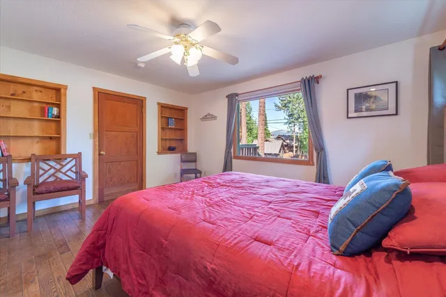 a bedroom with a bed and a chair