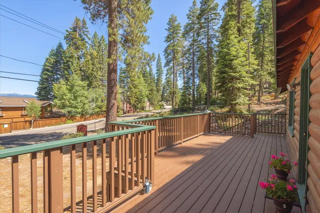 a view of balcony with wooden floor and outdoor space